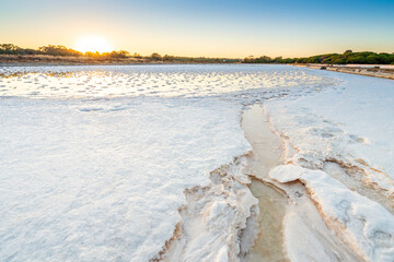 Ponds full of salt after evaporation of ocean water at salines in Faro, Portugal