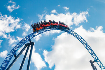 Ride roller coaster in motion in amusement park