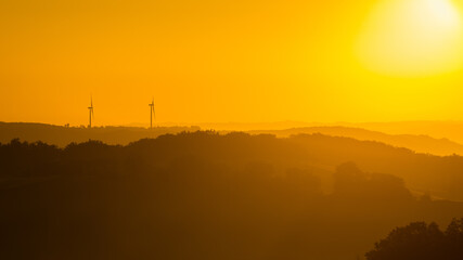 Wind turbines at sunrise in the Midi Pyrenees, France.