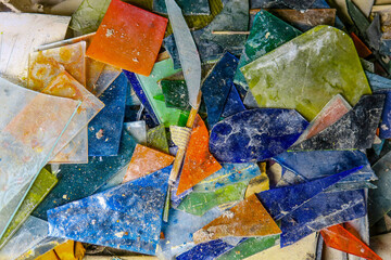 Fragments of old stained glass in the workshop