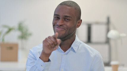 Portrait of African Man Pointing at Camera