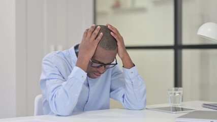Disappointed African Man Feeling Worried at Work