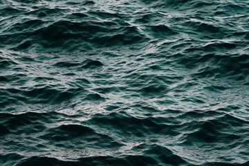 Sea of waves is blue green abstract background.