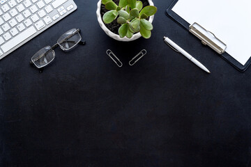 Office desk table mock up with computer keyboard and notepad