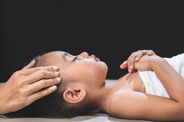 Mother is giving her daughter a relaxing massage and spa.