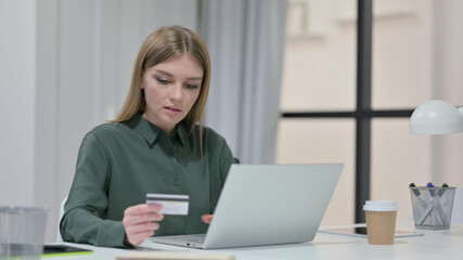 Online Shopping on Laptop by Young Woman 