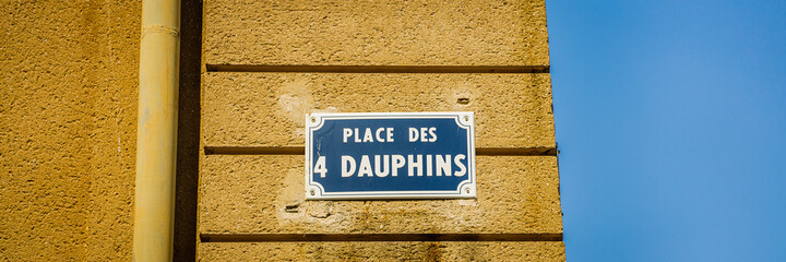 "Place des 4 Dauphins" street sign on the Four dolphins fountain square in Aix-en-Provence, France
