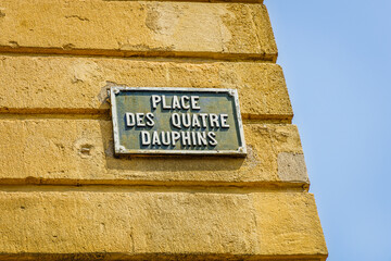 "Place des Quatre Dauphins" french street sign for the four dolphins square, in Aix en Provence