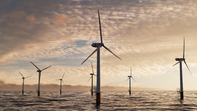 Wind Power. Offshore Wind Turbines at Sunset. Renewable Energy Concept.