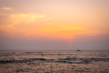 Fototapeta na wymiar Setting sun on Galle coast, Sri Lanka