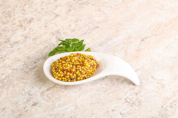 Grain mustard sauce in the bowl