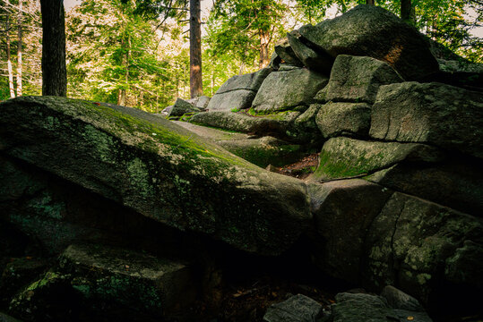 Curving stone hill with a carved dried waterfall at Purgatory Chasm Park in Massachusetts