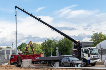 installing a lamppost with a crane