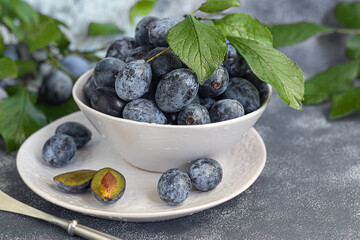 Plums on a light background. Harvesting the autumn harvest. Making jam and sauce. Still life.