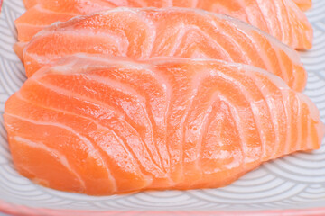 Salmon fillet sashimi photographed showing clear details.