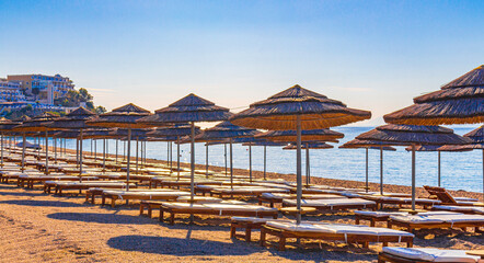 Sun loungers and parasols on the beach Kos island Greece.