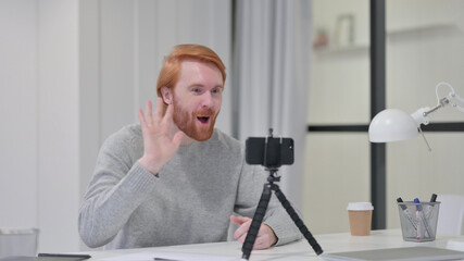 Video Chat on Smartphone by Young Beard Redhead Blogger