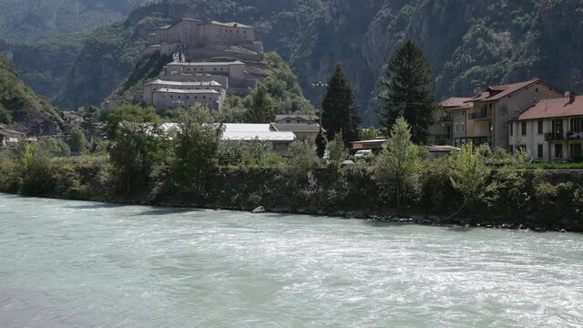 The Dora Baltea river flows under the hill of Bard's Fort, Valle d'Aosta, Italy