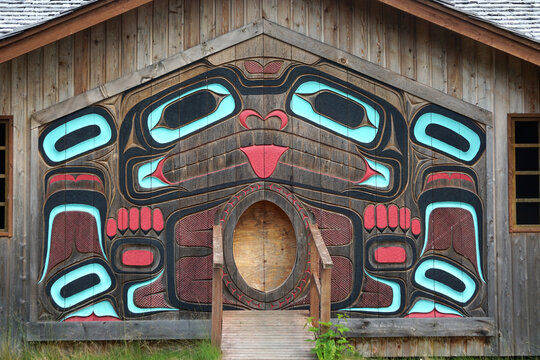 Ketchikan, Alaska / United States - July 19, 2017: The exterior of the clan house at Potlatch Totem Park, a recreated Tlingit village with totems, carving shed, and historical displays.