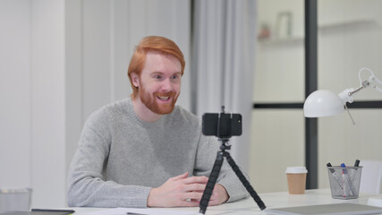 Video Recording on Smartphone by Young Beard Redhead Man 