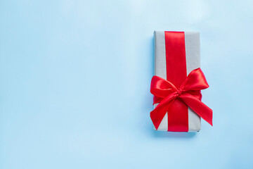 Present box with red bow. Image with copy space