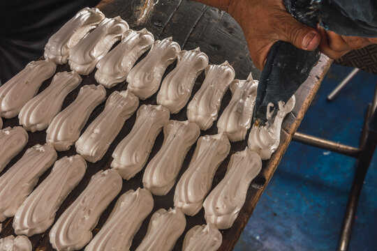 Artisanal process of making meringue, a traditional Mexican sweet, made from eggs, arina and sugar.