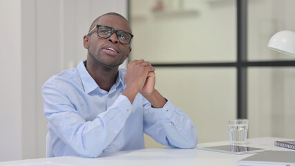 Pensive African Man Thinking at Work 