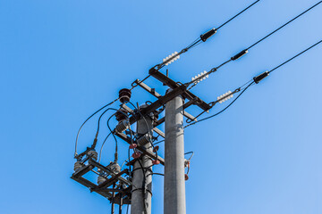 Power pole energy old electric line against blue sky
