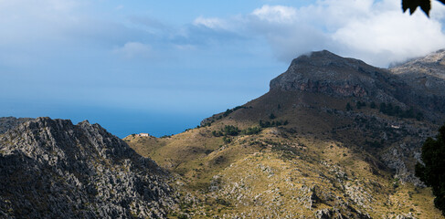 Landscape of the Island of Mallorca, Baleares, Spain, high in the mountain, hiking with a stunning view at the mediterranen sea fro the Tramontana Mountains 