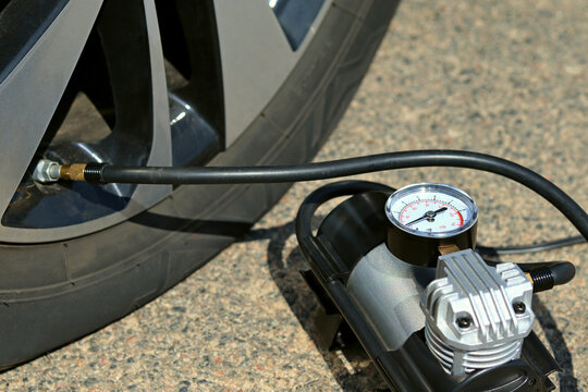 The deflated wheel is inflated by a compressor pump