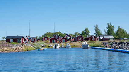 Fototapeta na wymiar Sandskar Island with Small idyllic Maritime fishing settlement in Haparanda archipelago National Park in Norrbotten County, Sweden.