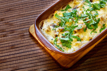 Baked meat with mushrooms and cheese. Al forno. Close-up, selective focus