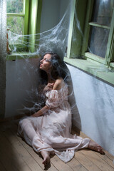 Fototapeta premium Woman in abandoned room