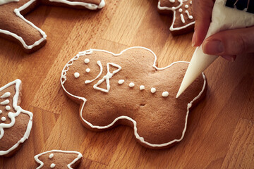 Decoration of homemade gingerbread Christmas cookies with icing