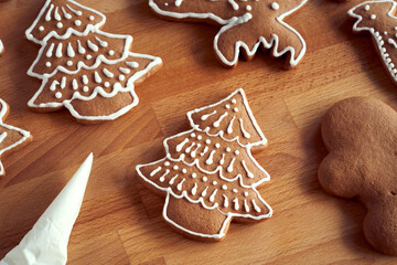 Decoration of homemade gingerbread Christmas cookies in the form of trees