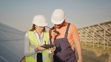 Technician and investor Using Infrared Drone Technology to Inspect Solar Panels in Solar cell Farm....