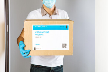 delivery medical box of vaccines. the courier delivers the vaccine. Covid 19 virus
