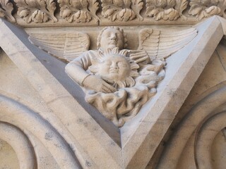 between the ornaments depictions of acts carved in stone