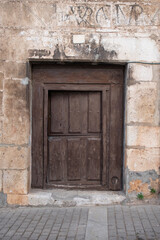 wooden door to access the house, old and made of elaborated wood.