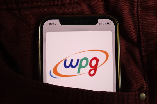 KONSKIE, POLAND - August 17, 2021: Wpg Holdings logo on mobile phone hidden in jeans pocket
