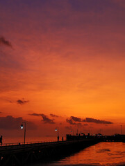 Colorful sunset on the beach. Reflection of the sunset sky in the water