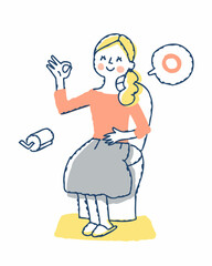 便座に座ってOKサインを出す笑顔の女性