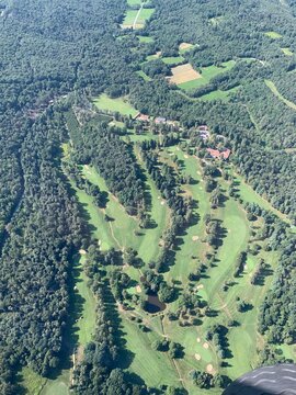 Aerial view of a golf course. Summer season.