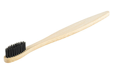 Bamboo wood toothbrush with black brush bristles isolated on a white background. Natural bamboo...