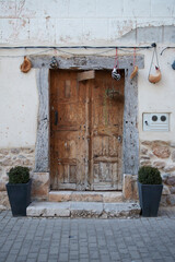 wooden door to access the house, old and made of elaborated wood. 