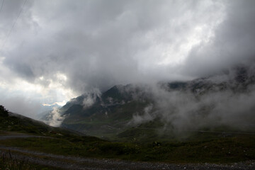 Amazing Landscape in the hearth of Switzerland. Epic scenery with the clouds and fog. Wonderful sunrays through the clouds and later an amazing sunset and sunrise. Perfect roadtrip through Switzerland