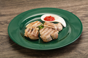 Grilled pork tenderlion with tomato sauce
