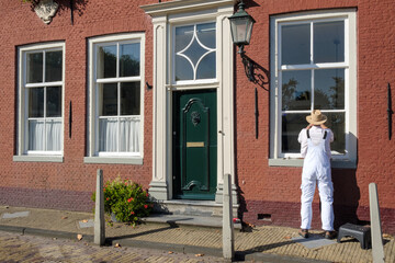 Painter at work in Edam, Noord-Holland province, The Netherlands - obrazy, fototapety, plakaty