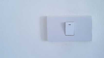 on off switch on white wall at home