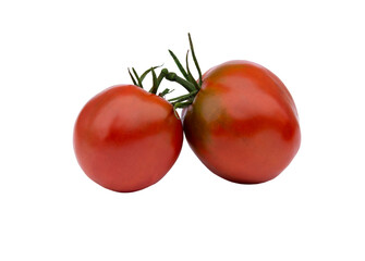 Two red tomatoes with green tails isolated on a white background